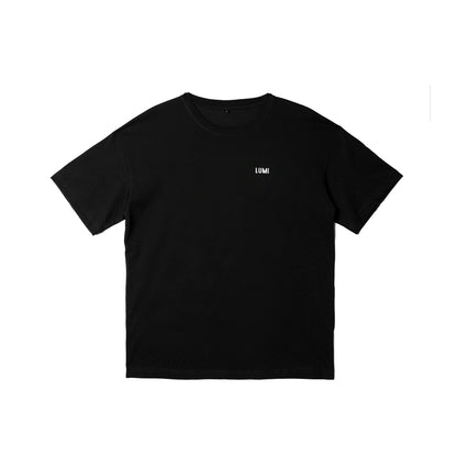 Men's LCC Oversized T-Shirt Black featuring a minimalist design with small LUMI logo on chest. Premium heavyweight black cotton t-shirt with relaxed fit and short sleeves, showcasing classic oversized silhouette perfect for casual wear.