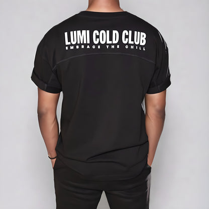 Mens LCC Oversized T-Shirt Black featuring white LUMI Cold Club text across back panel, shown from rear view with rolled sleeves and relaxed fit, displaying premium heavyweight cotton construction and paneled design details