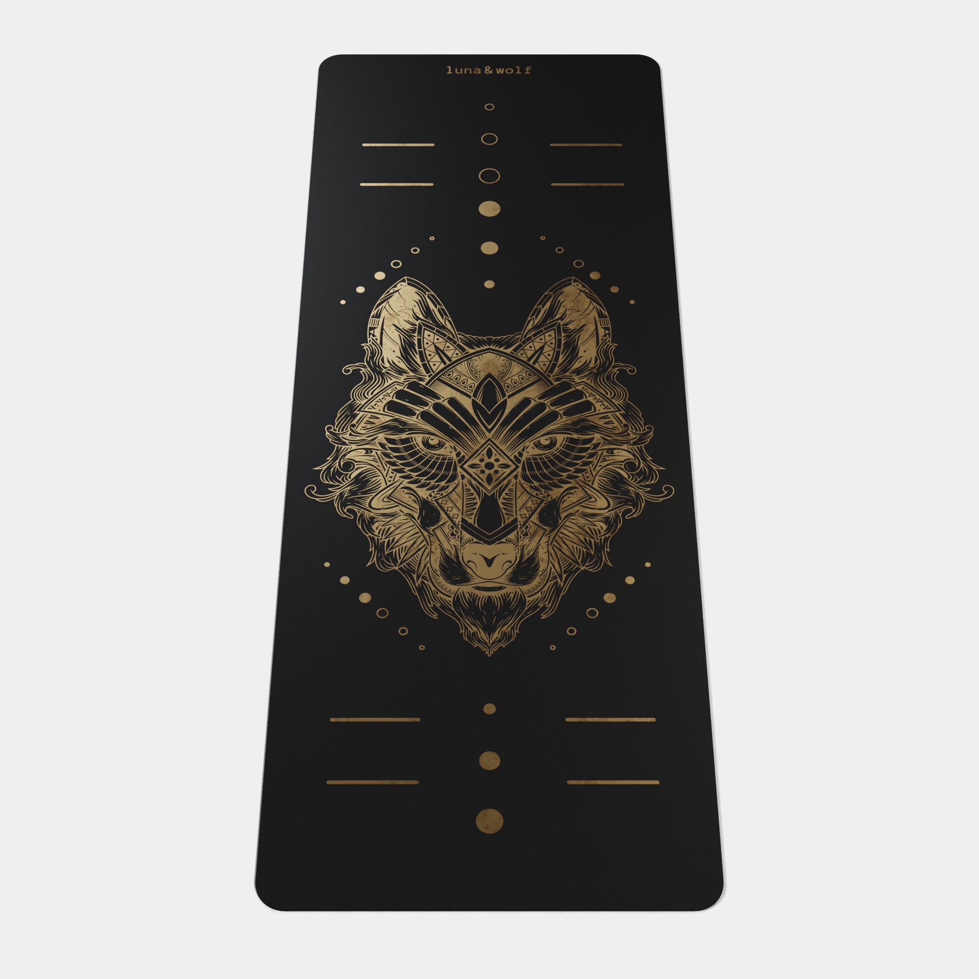 Eco Wolf Yoga Mat Gold Edition featuring a luxurious black mat with intricate geometric wolf head design in metallic gold, alignment markers, and Luna & Wolf branding. Premium 4mm thick mat with artistic tribal-style wolf illustration centered on dark background.