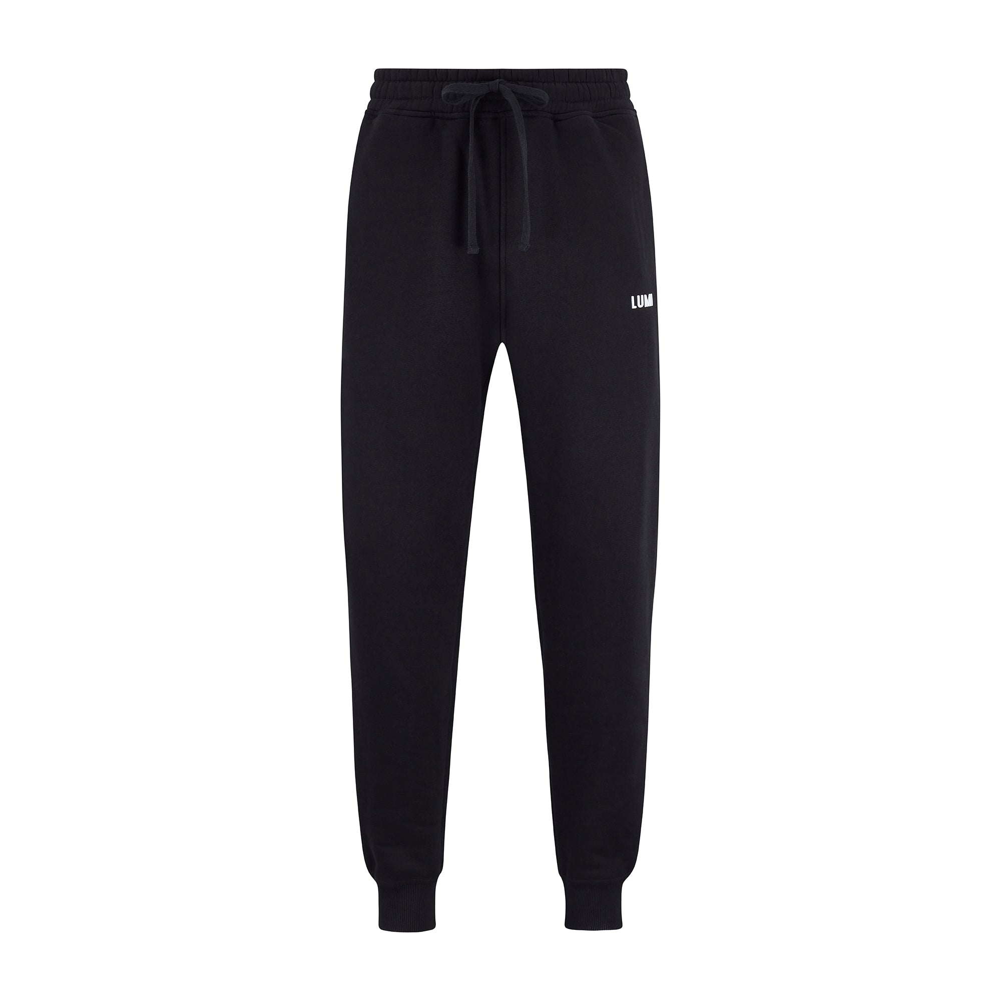 Men's LCC Sweatpants Black shown in relaxed fit with elasticated waistband, cuffed ankles, and small white LUMI logo. Made from heavyweight black cotton-polyester blend fabric, featuring drawstring closure and classic jogger silhouette perfect for casual wear.