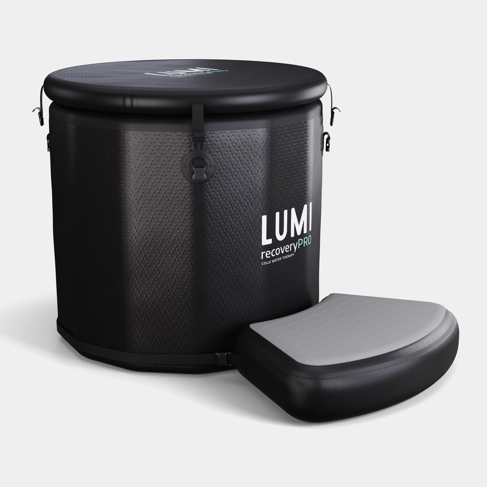 PRO Barrel Step - Inflatable black and grey non-slip platform with textured grip surface, shown next to LUMI Recovery PRO ice barrel. Made from durable Fibreglass Reinforced PVC, designed for safe ice bath entry and exit.