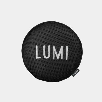 LUMI Scum Sponge shown as a circular black microfiber mesh cleaning device with white LUMI text embroidered on its surface, designed for ice bath maintenance and oil absorption, photographed against a white background.