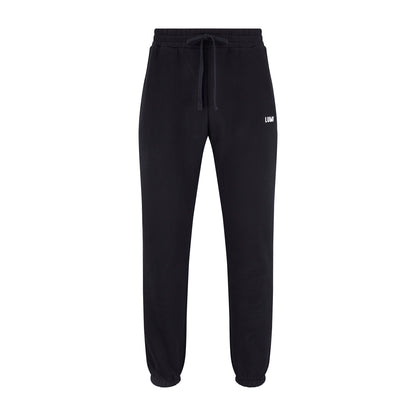 Women's LCC Sweatpants Black featuring relaxed-fit design with elasticated waistband and cuffed ankles, made from heavyweight cotton-polyester blend fabric, showcasing small LUMI logo on leg, perfect for casual wear and athletic activities