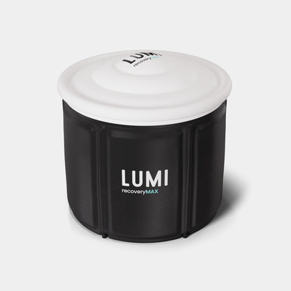 LUMI Pod MAX Ice Bath featuring a sleek black cylindrical tub with white insulated lid, showcasing LUMI branding. Premium portable ice bath container with thermal insulation and weather-resistant design for cold therapy and recovery.